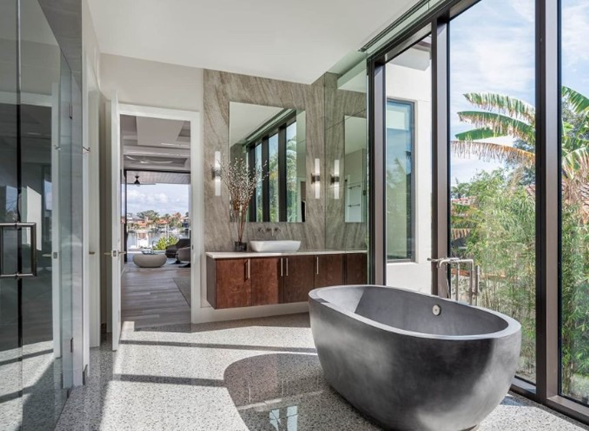 freestanding tub with floor to ceiling windows